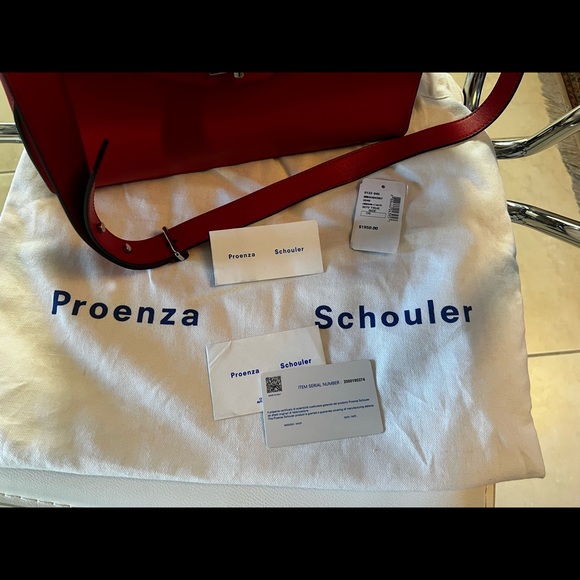 Proenza SchoulerDepth:4.75"
Strap 20"
Width:12.5"
Handle Drop:5.25"
Height:9.75” - Picture 5 of 10